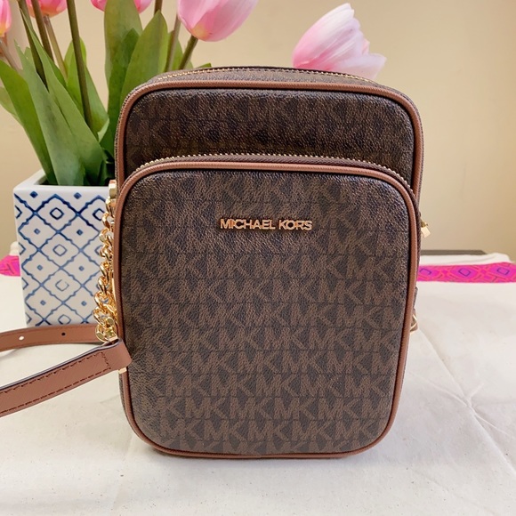 Michael Kors Handbags - Michael Kors Jet Set Flight Crossbody Bag in brown signature